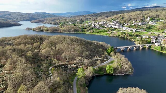 Aerial view of encoro de prada reservoir near a veiga village
