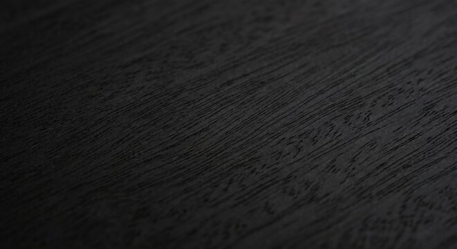 Black ebony wood surface close-up texture background