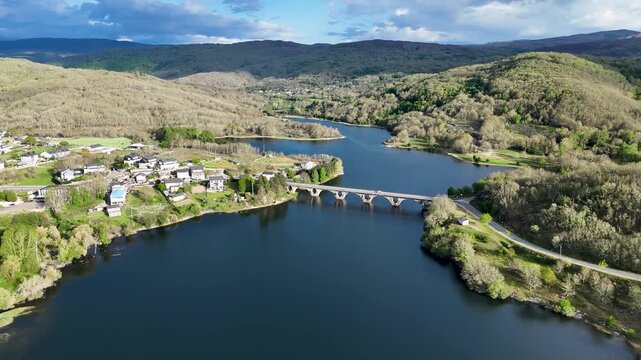Aerial view of prada reservoir and stone bridge in galicia spain