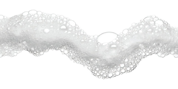 Soft white soap foam texture with bubbles forming a wavy line across the frame