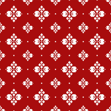 Red seamless background with white floral geometric motifs arranged in a grid. Traditional pixel-style textile pattern featuring symmetrical ornaments, minimal folk elements, and clean repeating layou