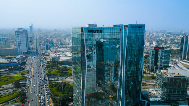 Majestic bird's eye view from a drone showing the Westin Hotel and the bustling Javier Prado Avenue in the heart of San Isidro.