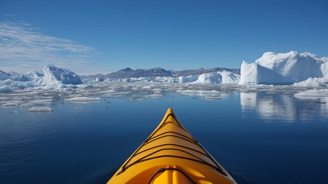 Close-up of a kayak with icebergs floating nearby in Arctic waters, water travel and climate change concept, adventure photography, with copy space