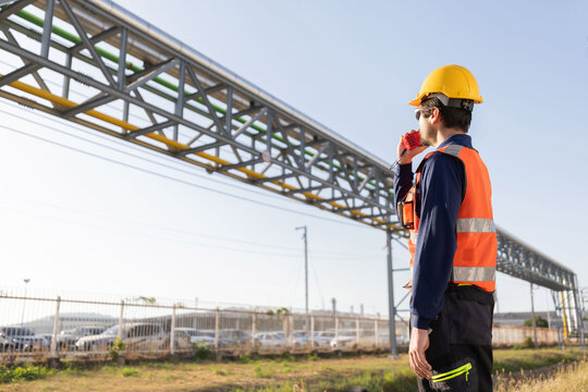 Petroleum engineers with hardhat working at oil refinery site