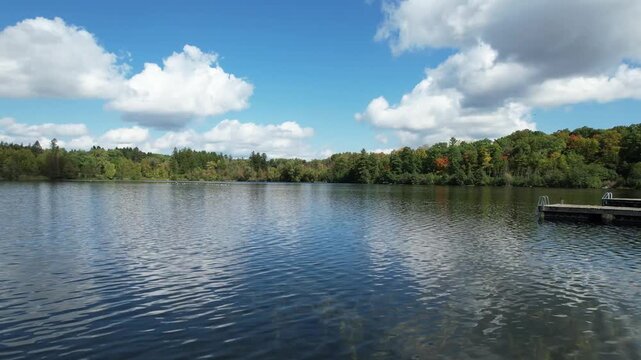 Calm Lake Seneca With Forest and Cloud Reflection in Ontario