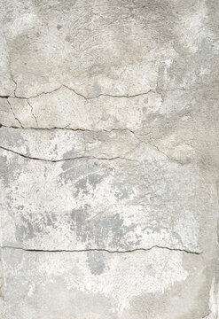Cracked Concrete Wall Texture. cracked concrete or plaster wall surface, showing natural fractures, rough texture, and subtle variations in gray tones. Ideal for use in construction themes.