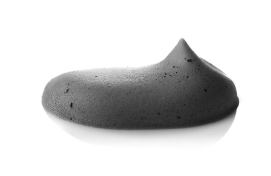 Charcoal facial cleansing foam texture smear isolated on white background