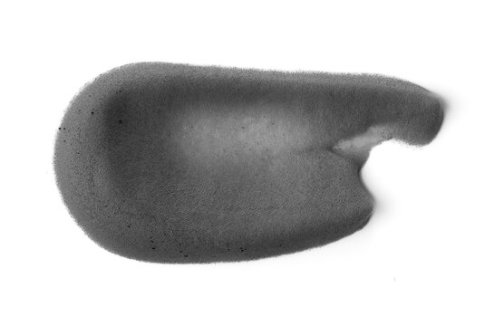 Charcoal facial cleansing foam texture smear isolated on white background