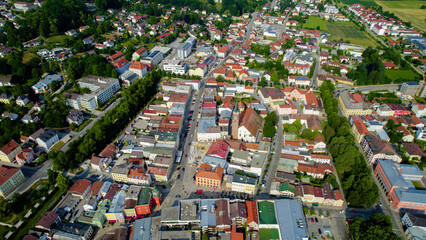 Fototapeta premium Aerial view of the old town and city Pfarrkirchen in Germany, Bavaria on a sunny noon spring day