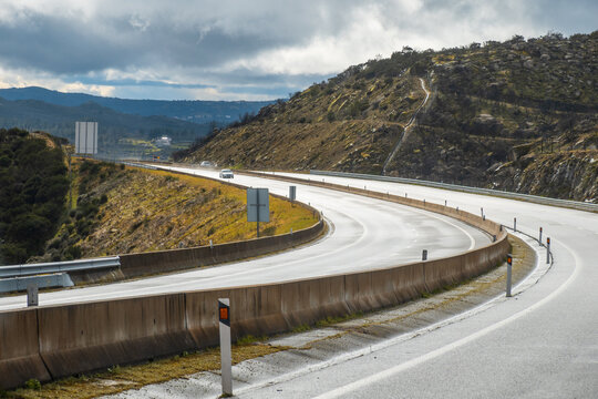 Driving on a road in the Douro valley in stormy weather - Portugal