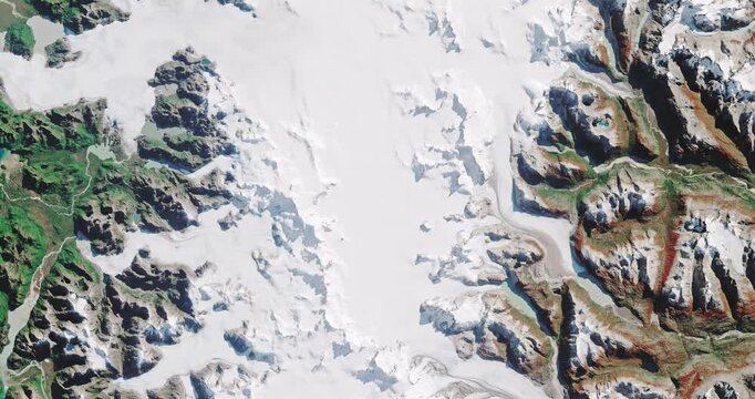 Panoramic top view of north Patagonia. Ice, glaciers and mountains covered with snow. Camera is moving left and down. Animation based on image by NASA