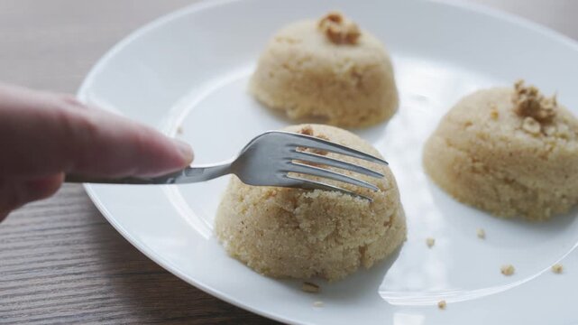 Close-up of traditional Turkish semolina halva with hazelnuts