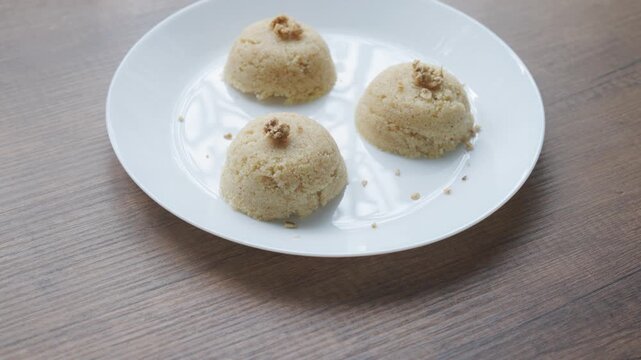 Close-up of traditional Turkish semolina halva with hazelnuts