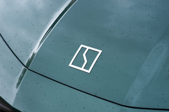 Kyiv, Ukraine. May 2, 2026. Minimalist Zeekr car hood emblem on wet surface with raindrops, modern EV design detail.