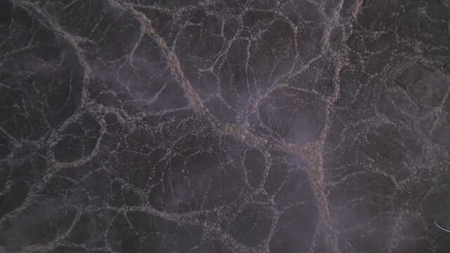 Aerial Top-Down View of Bubbling Wastewater in Treatment Tank