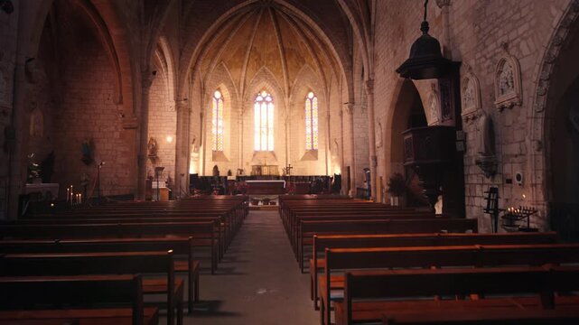 Issigeac Bastide Church Nave and Altar with Sunlight Rays