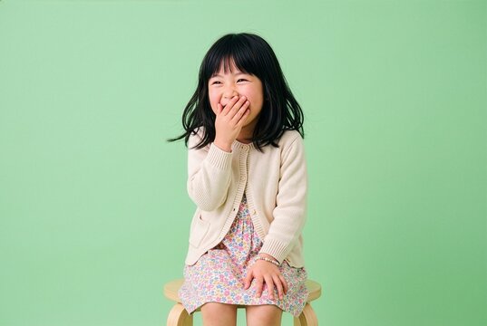 Candid giggling of a 6-year-old Japanese girl