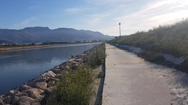 View of the Martil Valley in Tetouan, Morocco, in springtime - formerly known as R&iacute;o Mart&iacute;n. Mount Bouanane is in the background; the mountain rises gracefully, its rugged slopes adorned with greenery