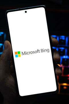 Punta Arenas, Chile &ndash; May 04, 2026: Close-up of a mobile device screen showing the Microsoft Bing search engine logo, held by a user in a dimly lit room with vibrant RGB keyboard lighting