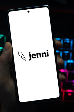 Punta Arenas, Chile &ndash; May 04, 2026: Close-up of a mobile device screen showing the Jina AI search foundation brand, held by a user in a dimly lit room with vibrant RGB keyboard lighting