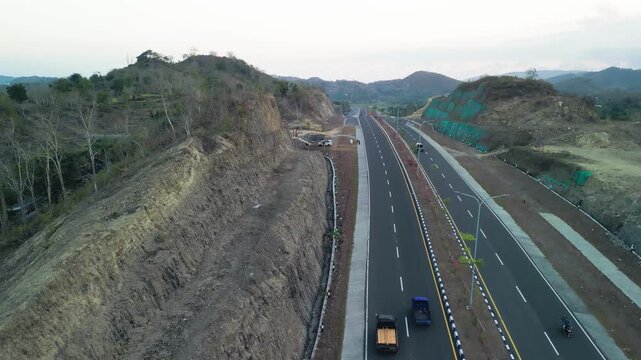 Stunning aerial view of Jl Bypass BIL Mandalika road during sunset in Lombok