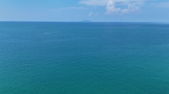 Vast Blue Ocean and Clear Sky Distant Clouds, Faint Island on Horizon, Tranquil Sea and Water Views