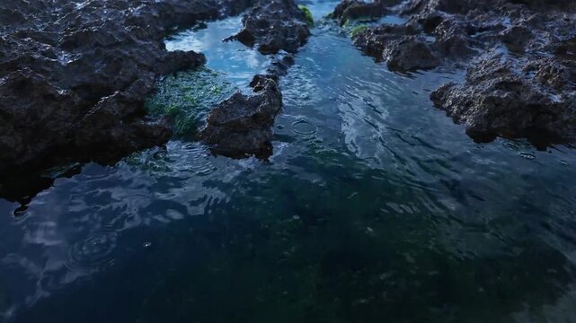 Deep Coastal Rock Pool with Blue Water and Natural Reflections