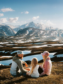 Family vacations outdoor parents and kid travel together in Norway - mother, father and child on summer camping hiking trip healthy lifestyle, people enjoying mountains view in Lahko national park