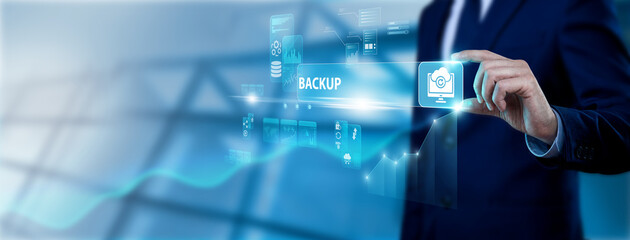 Fototapeta premium IT specialist hand holding data backup interface on digital screen, cloud storage solutions, data protection, system recovery, secure information management and disaster recovery concept