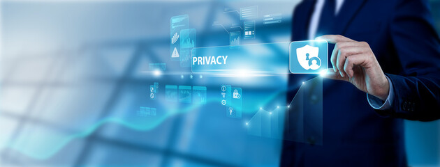 Fototapeta premium Compliance Officer Hand Holding Privacy Interface on Digital Screen, enforcing data protection protocols. Safeguarding personal information through encryption and strict access controls.