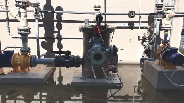 Industrial facility for precious metal recovery and galvanic salt production partially submerged in water