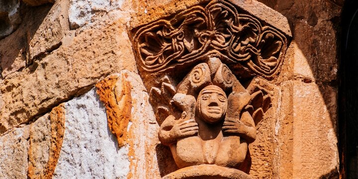 Capital on a column showing a woman with her legs open and displaying her genitals. Sculptures depict explicit sexual images, which was not unusual in Romanesque Art.