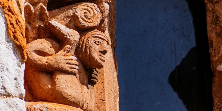 Capital on a column showing a woman with her legs open and displaying her genitals. Sculptures depict explicit sexual images, which was not unusual in Romanesque Art.