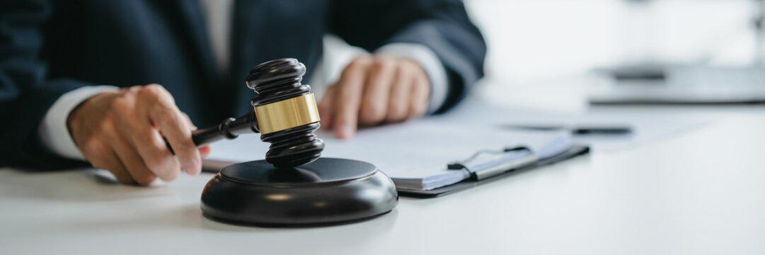 Attorney consulting on legal matters in law firm office