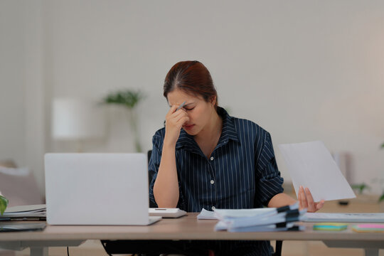 Bored unmotivated female working at home