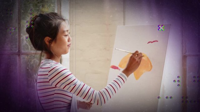 Artist painting orange arc at art easel overlays over canvas as mentor entering giving feedback