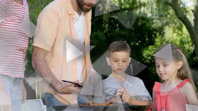 Man picking meat with tongs, placing on grill for family, kids watching, tri overlay obscuring view
