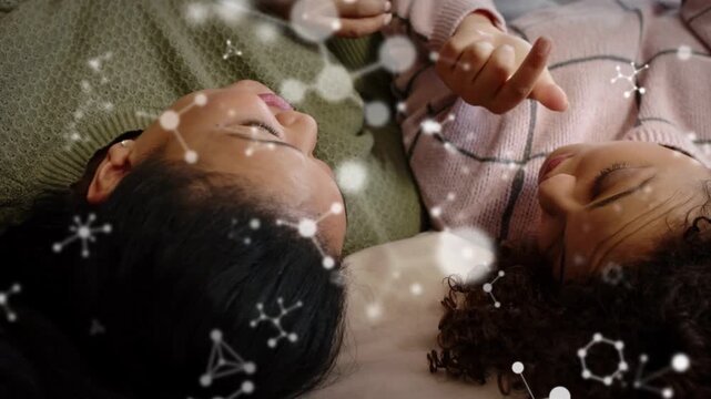 Right woman raising hand, finger counting; left woman responding on bed; drifting overlay learning