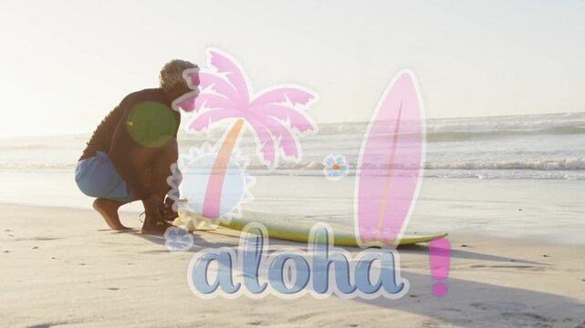 Male surfer crouching, reaching board and fastening leash, preparing to surf with aloha overlay