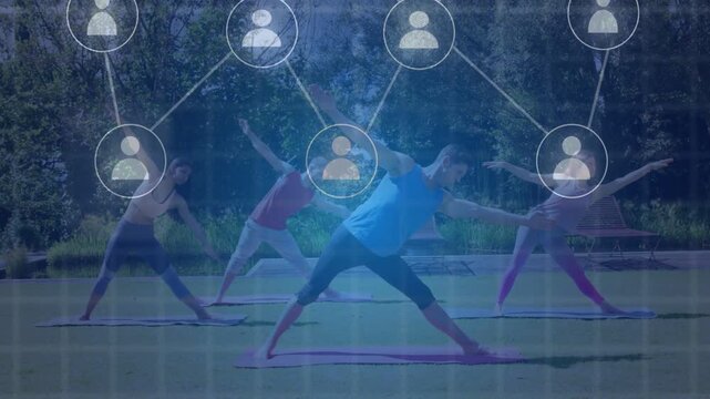 Lead coach holding pose in park node rising above growing into network joining mats showing fitness
