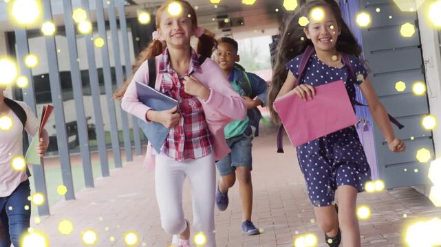Two girls and classmates running in school hallway after bell, animated yellow particles over bags