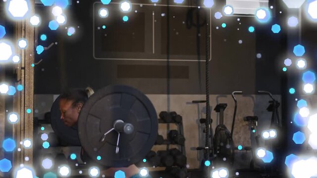 Fitness trainee bracing and doing barbell squat for strength, bokeh overlay intensifying, obscuring
