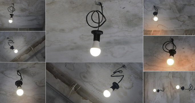 Bright idea conceptual: single glowing bulb against dark raw concrete.