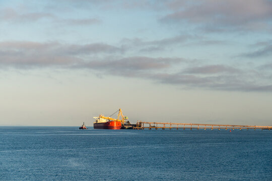 Canada, BC, Delta.  Bulk cargo ship loading coal at the end of Deltaport.