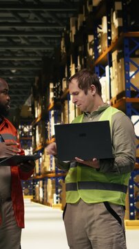 Vertical Video E-commerce colleagues, following packages, on tracking software, using awb tags, tracking info to update the parcel status on tablet and laptop. Overseeing dispatch shipment of