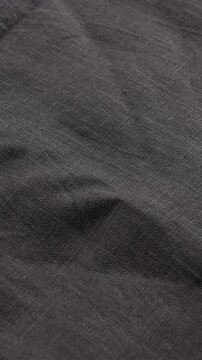 dark fabric gray natural textile background cotton or linnen vertical video