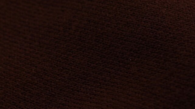 dark knitted textile woolen background element of garment