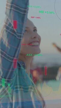 Vertical video: Market tickers appearing, woman turning, raising arms at dock, charts onscreen