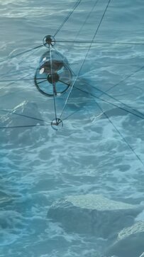 Vertical video: Wind gust pushing two pods down up right, tilting cables and steadying over surf