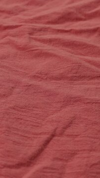 pink natural textile background cotton or linnen vertical video